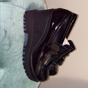 Glossy black platform loafers